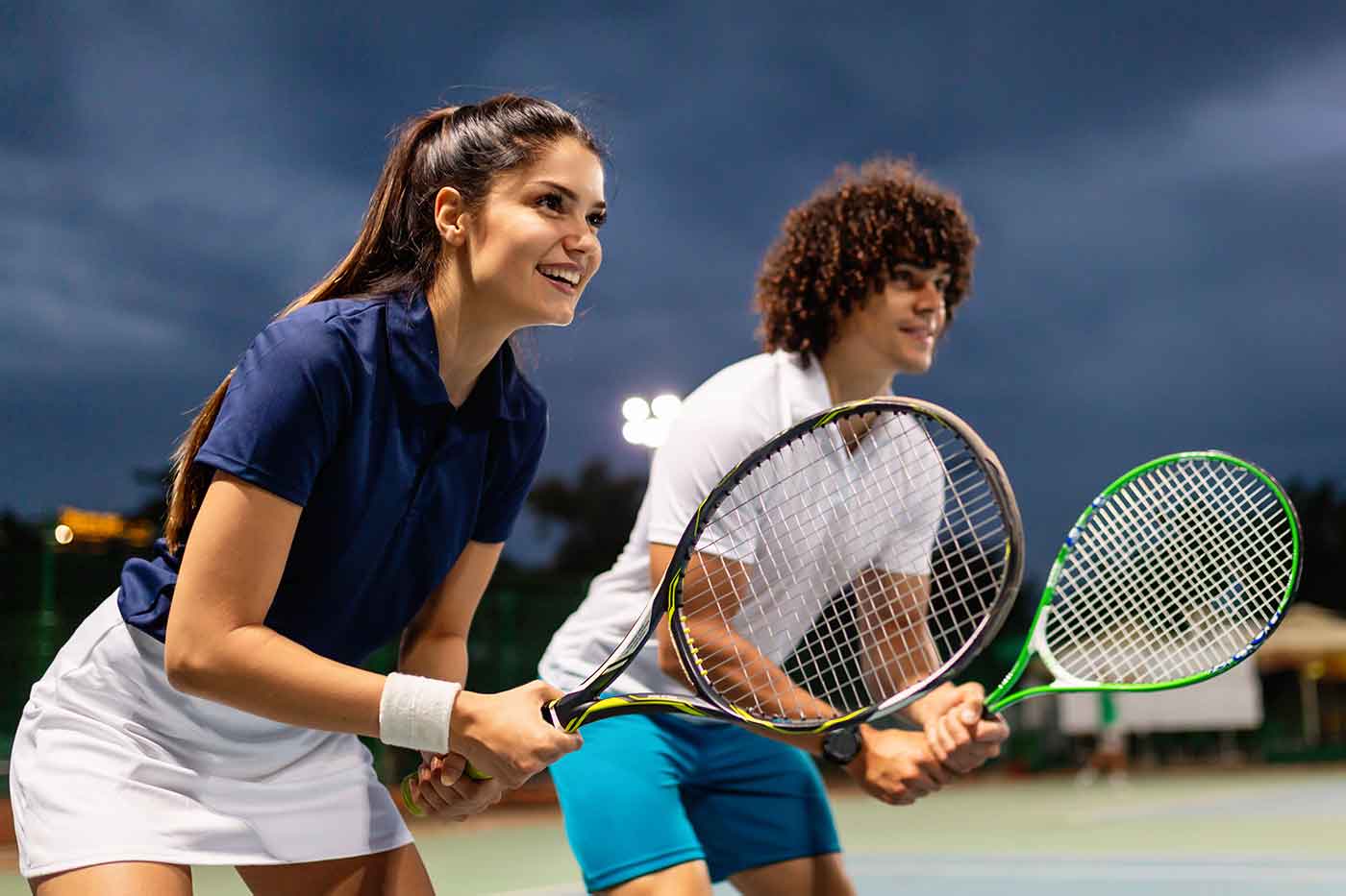 Young people are playing tennis