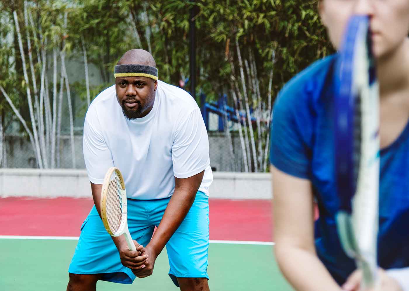 Couple playing tennis as a couple