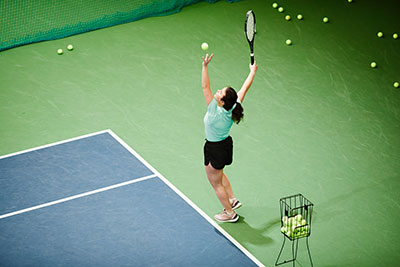 Girl setting up shot for tennis